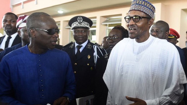 Nigerian President Muhammadu Buhari (R) and his Beninoise counterpart Patrice Talon inspect facilities as they arrive for the inauguration of the Nigeria-Benin joint border posts at Seme-Krake in Badagry district of Lagos, Nigeria's commercial capital on October 23, 2018. - The presidents inaugurated the newly built Seme-Krake joint border posts of the two countries to enhance free movement of people and goods and economic activities in the region. (Photo by PIUS UTOMI EKPEI / AFP)