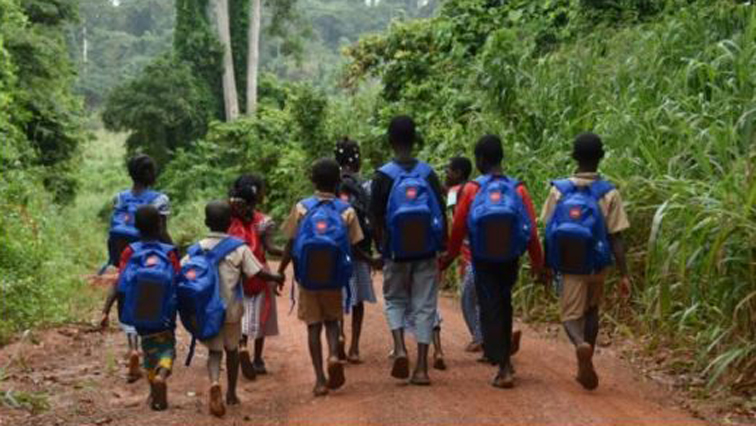School kids carrying their solar backpacks