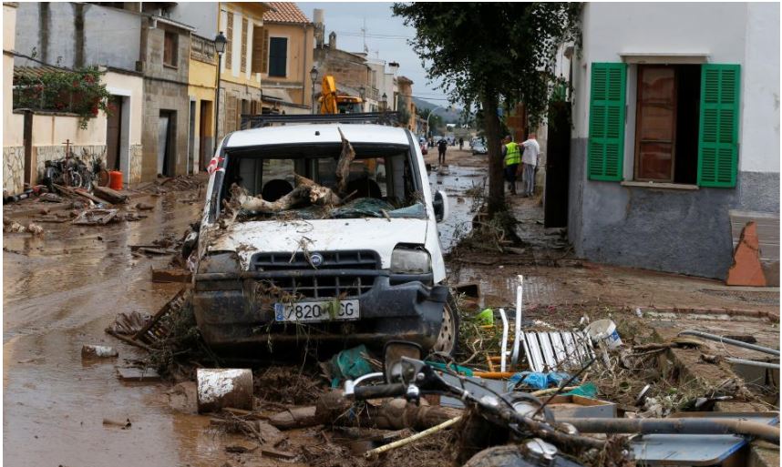 Heavy rain hit Mallorca on Tuesday, sending torrents of brown water along narrow streets in the town of Sant Llorenc.