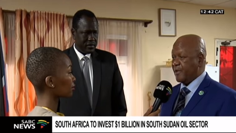 SABC Business Reporter Nzinga Qunta interviewing Energy Minister Jeff Radebe with his South Sudanese counterpart Petroleum Minister Ezekiel Lol Gatkuoth.