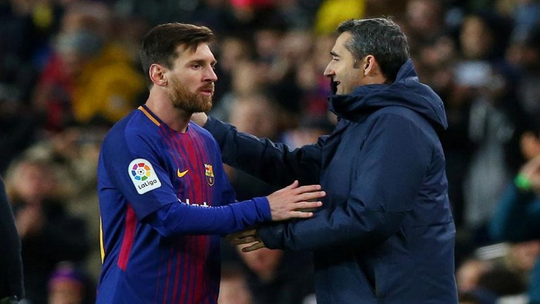 Barcelona's Lionel Messi with coach Ernesto Valverde as he is substituted.