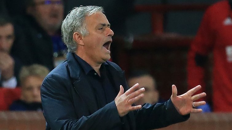 Manchester United's Portuguese manager Jose Mourinho shouts instructions to his players from the touchline.