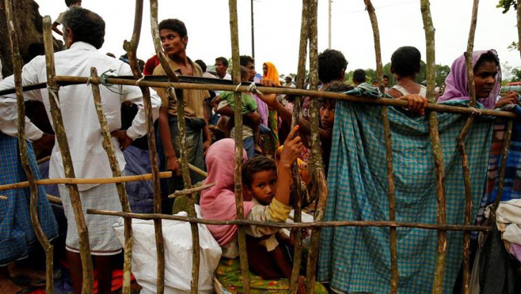 New Rohingya refugees wait to enter the Kutupalang makeshift refugee camp, in Cox’s Bazar, Bangladesh.
