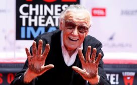 Stan Lee with his hands up