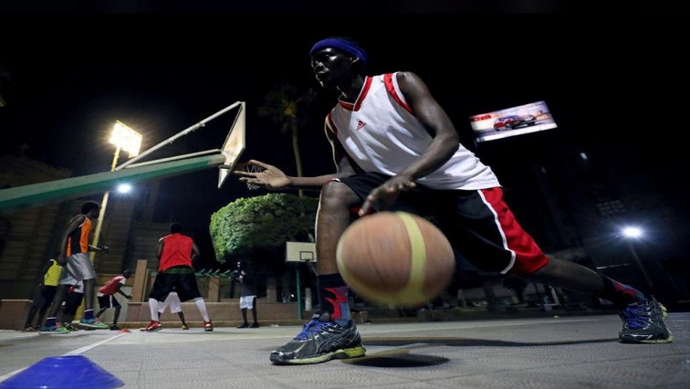 A Sudanese refugee dribbles the ball during a basketball game in Cairo, Egypt September 24, 2018.
