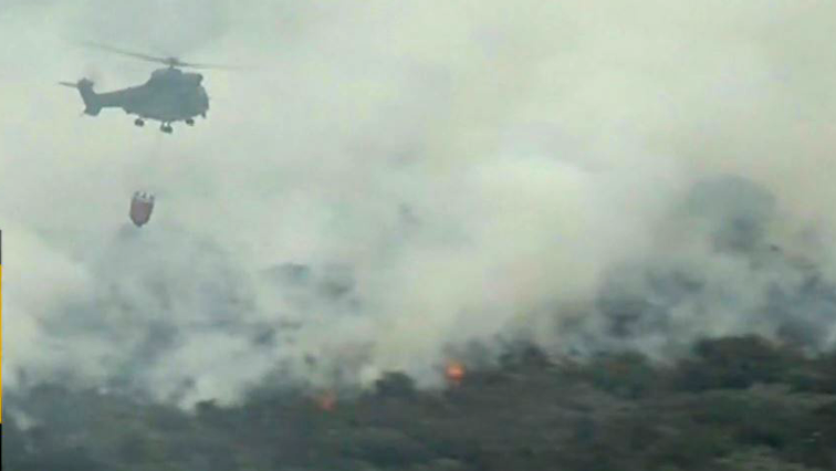 Two helicopters deployed to waterbomb fire on Table Mountain range
