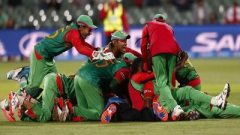 Bangladesh's cricket team mates celebrating.