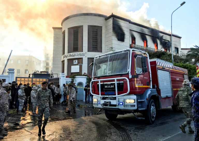 A firetruck and security officers at the scene of an attack on the Libyan foreign ministry in Tripoli on December 25, 2018