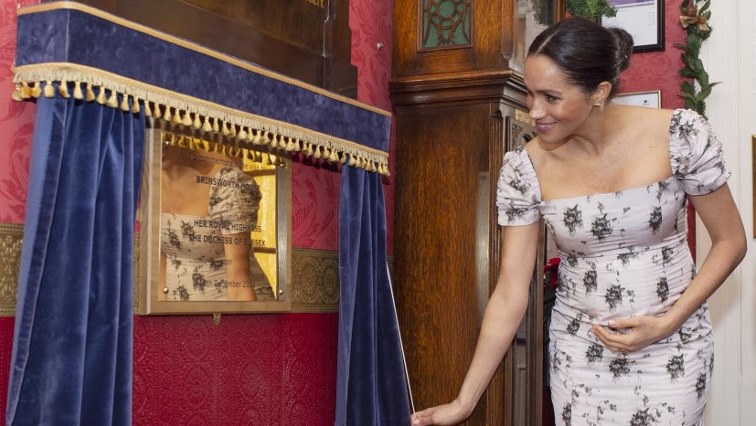Britain's Meghan, Duchess of Sussex unveils a plaque to commemorate her visit to the Royal Variety Charity's residential nursing and care home, Brinsworth House in Twickenham.