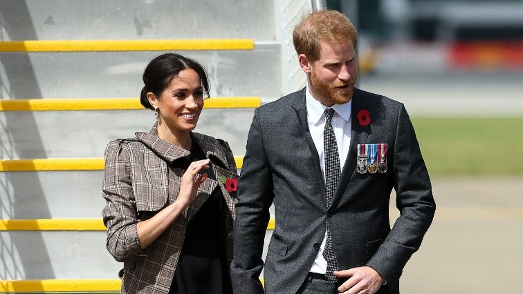 Britain's Prince Harry (R) and his wife Meghan (L), the Duchess of Sussex.