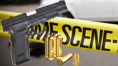 A gun, bullets and yellow crime scene tape in the picture