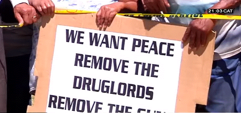 We want peace, remove the druglords... poster