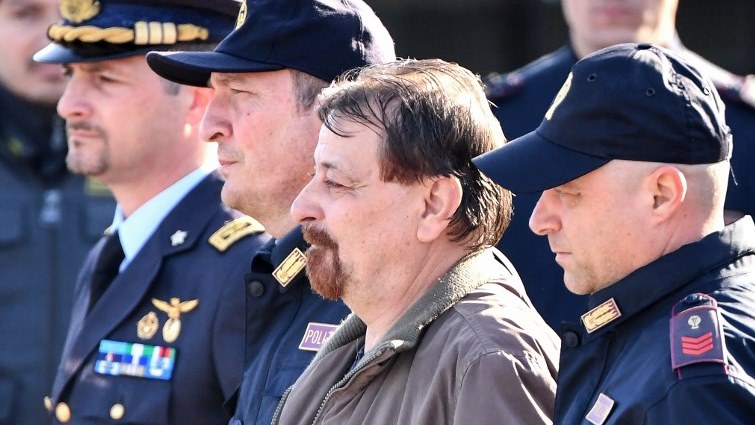 Italian former communist militant Cesare Battisti (C), is wanted in Rome for four murders attributed to a far-left group in the 1970s.