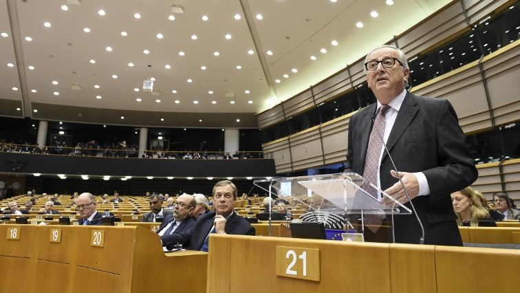 President of the European Union Commission Jean-Claude Juncker (L) speaks during a session of the parliament at the EU headquarters.