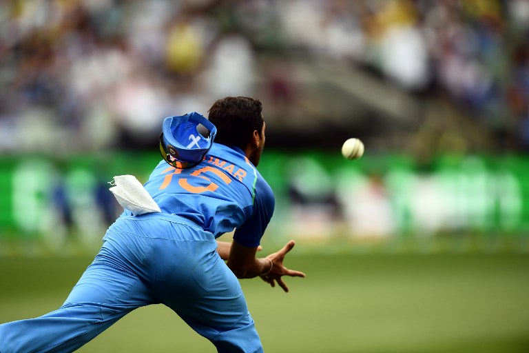 India's Bhuvneshwar Kumar catches the ball to dismiss Australia's Glenn Maxwell during the third one-day international cricket match between Australia and India at the Melbourne Cricket Ground in Melbourne on January 18, 2019.