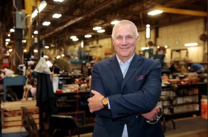 Bob Roth, CEO of transformer manufacturer RoMan Manufacturing poses for a photograph in his plant in Grand Rapids.