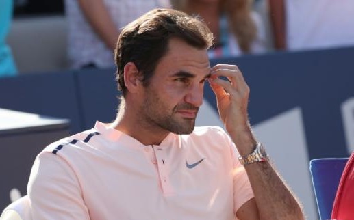 Roger Federer of Switzerland looks at the award ceremony as Alexander Zverev of Germany (not pictured) won during the Rogers Cup tennis tournament at Uniprix Stadium.