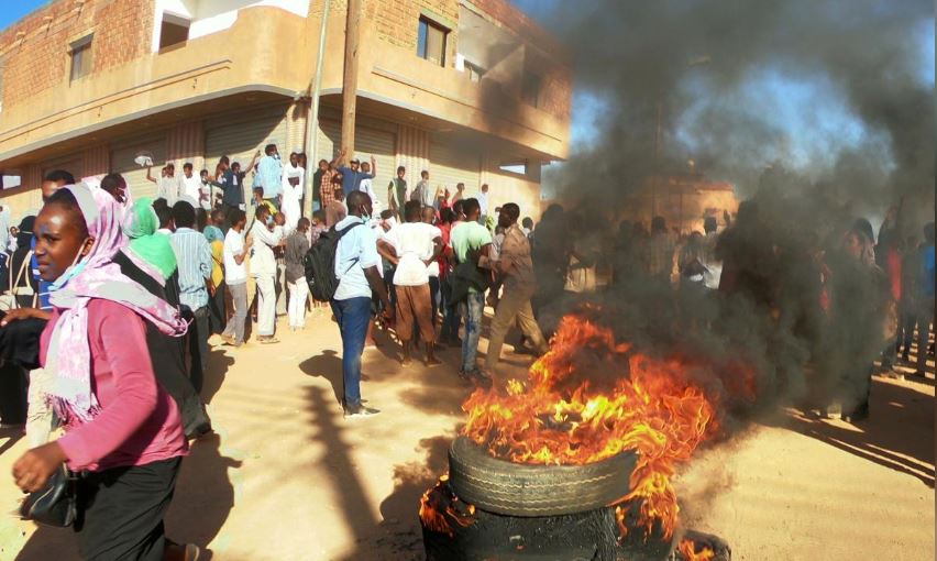Sudanese demonstrators burn tyres as they participate in anti-government protests in Omdurman, Khartoum, Sudan.