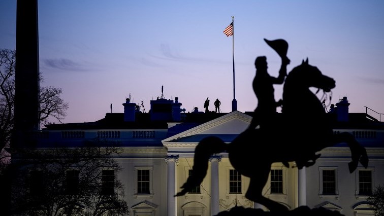Secret Service counter snipers are seen on the roof of the White House