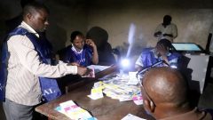Agents of Congo's National Independent Electoral Commission count casted ballot papers after election at a polling station