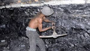 A miner mining coal