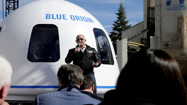 Amazon and Blue Origin founder Jeff Bezos addresses the media about the New Shepard rocket booster and Crew Capsule mockup at the 33rd Space Symposium in Colorado Springs, Colorado, United States April 5, 2017.