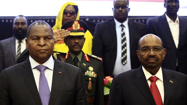Central African president Faustin-Archange Touadera (L) and Sudanese President Omar al-Bashir (R) attend the inking of a peace deal between the government of CAR  and 14 armed groups in Khartoum.