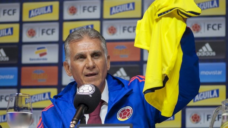 Colombia's national football team new head coach, Portuguese Carlos Queiroz, holds up a Colombian jersey.