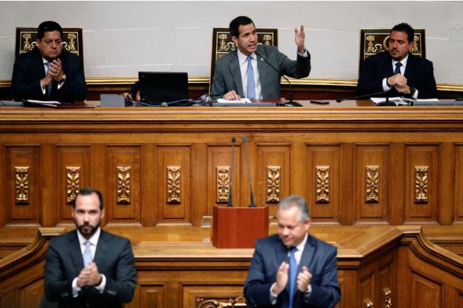 Venezuelan opposition leader Juan Guaido, who many nations have recognized as the country's rightful interim ruler, attends a session of Venezuela's National Assembly.