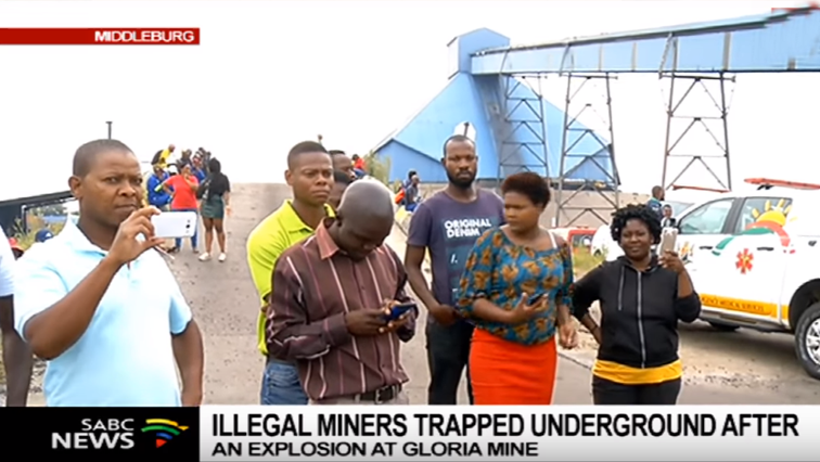 Community members waiting outside the mine