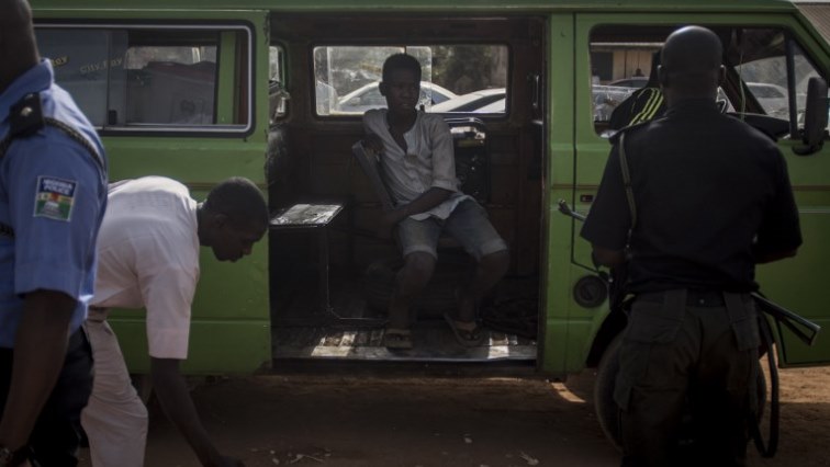 A mini bus waits outside a registration area in Kaduna.