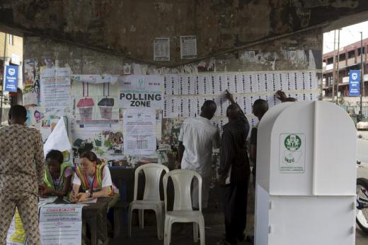 Voters find their names on voting lists during governorship elections in Lagos, Nigeria, 11 April 2015.