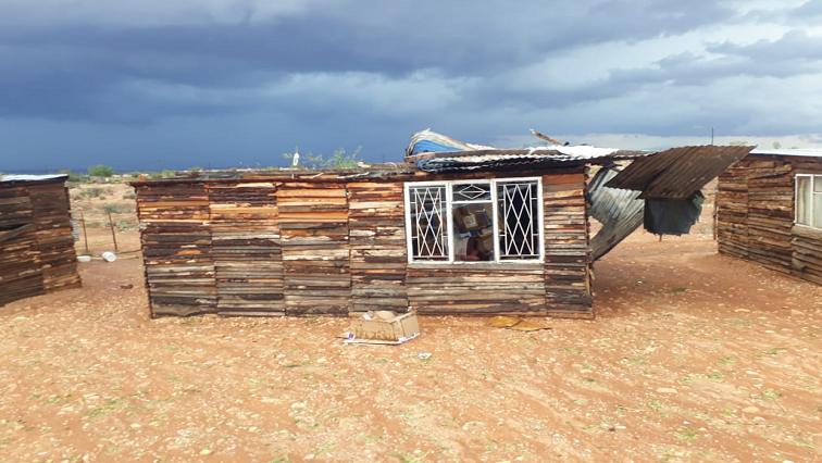 A shack with a damaged roof