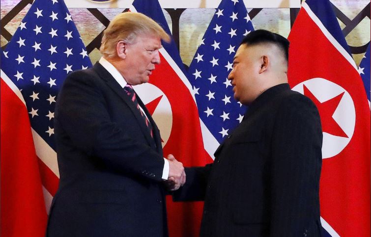 President Donald Trump and North Korean leader Kim Jong Un shake hands before their one-on-one chat.