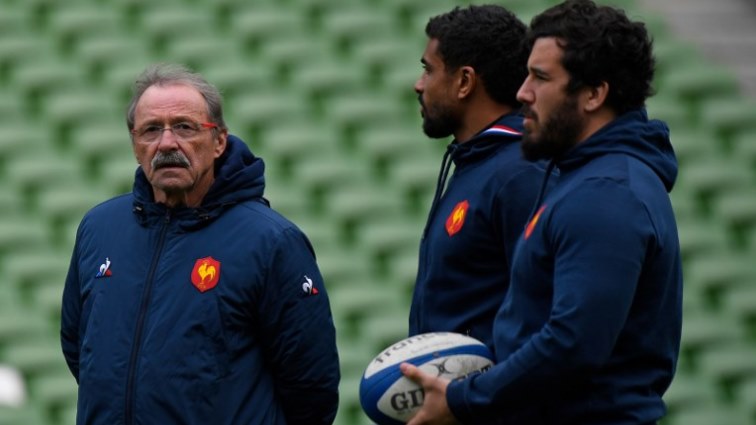 France's head coach Jacques Brunel (L) waits with France's centre Wesley Fofana and France's prop Etienne Falgoux.