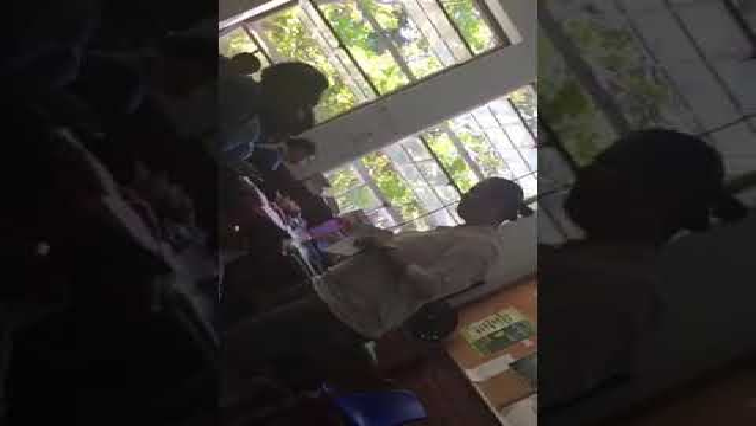 Teacher slaps learner.