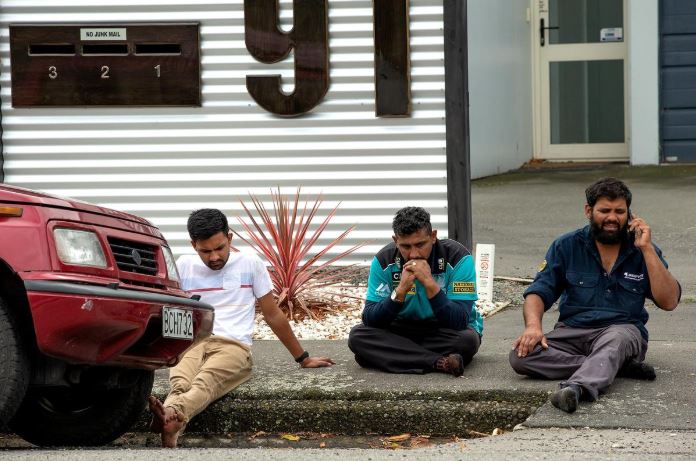 Grieving members of the public following a shooting at the Al Noor mosque in Christchurch, New Zealand.