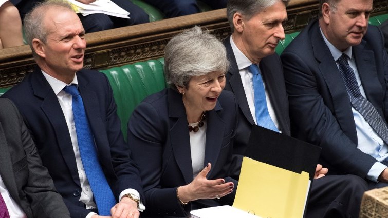Britain's Prime Minister Theresa May reacting during the weekly Prime Minister's question and answer session in the House of Commons in London.