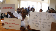 Doctors holding placards.