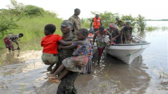 People in a boat escaping floodwaters