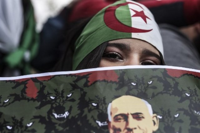 Protesters rally against the Algerian ruling party  at the Place de la Republique in Paris.