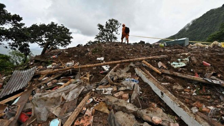 The mudslide attributed to the heavy rains that have battered the country for several weeks.