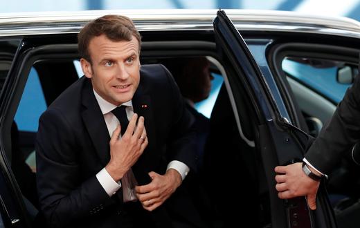 French President Emmanuel Macron arrives at a European Union emergency summit on Brexit in Brussels.
