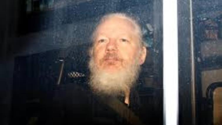 WikiLeaks founder Julian Assange is seen as he leaves a police station in London.