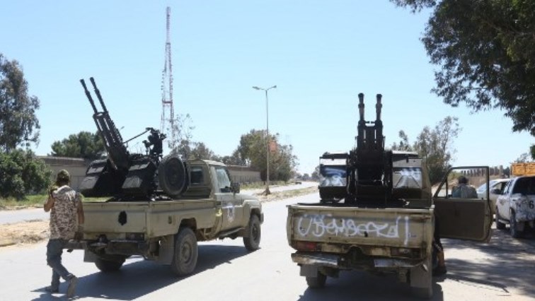 Gun-mounted vehicles belonging to fighters loyal to the internationally recognised Libyan Government of National Accord (GNA) are pictured near a military compound in a suburb of the capital Tripoli.
