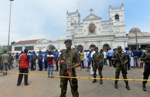 Sri Lankan security personnel keep watch outside the church
