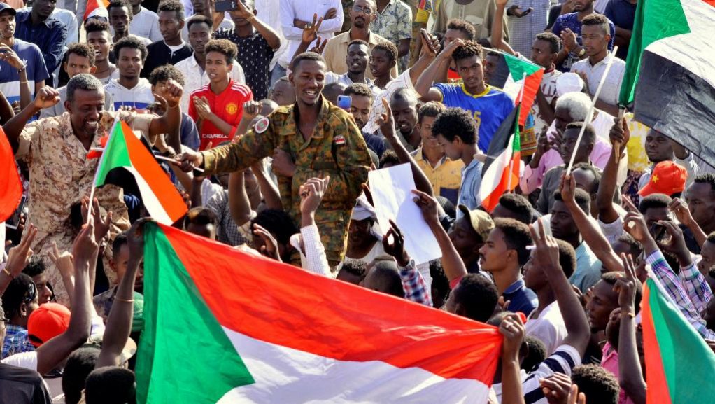 Sudanese holding flags
