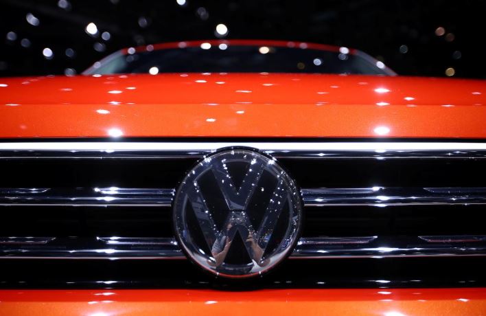 A Volkswagen logo is seen on a new car model at the 89th Geneva International Motor Show in Geneva.