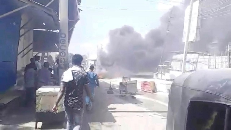 Debris burn on a street in Mogadishu,
