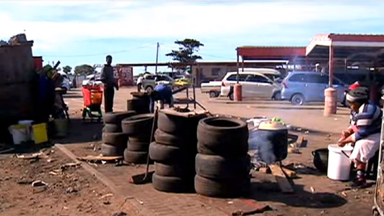 Township area with tyres on the side of the road